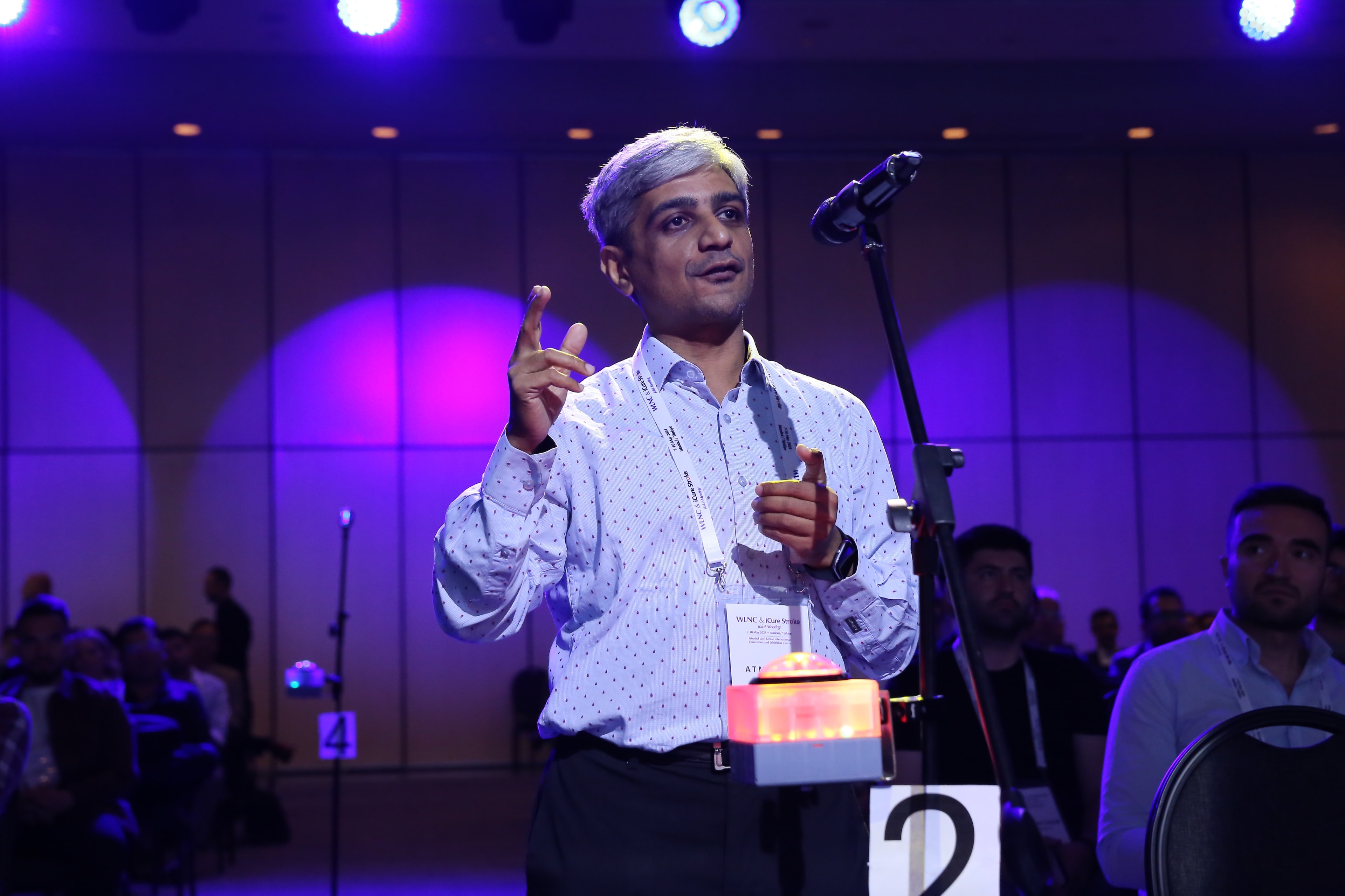Participant speaking during WLNC 2024 with Spotlight Button illuminated in active mode, signalling live participation in the session’s Q&A.